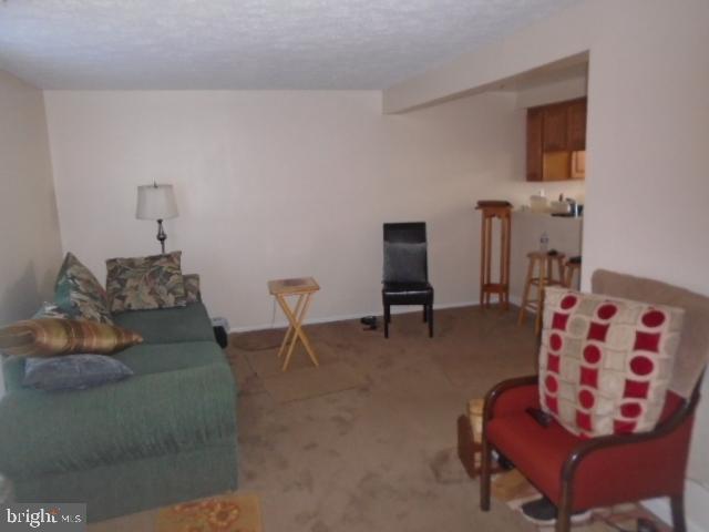 109 Kettering Drive Upper Marlboro, MD 20774 - Photo 5 of 15 a living room with furniture and a chair