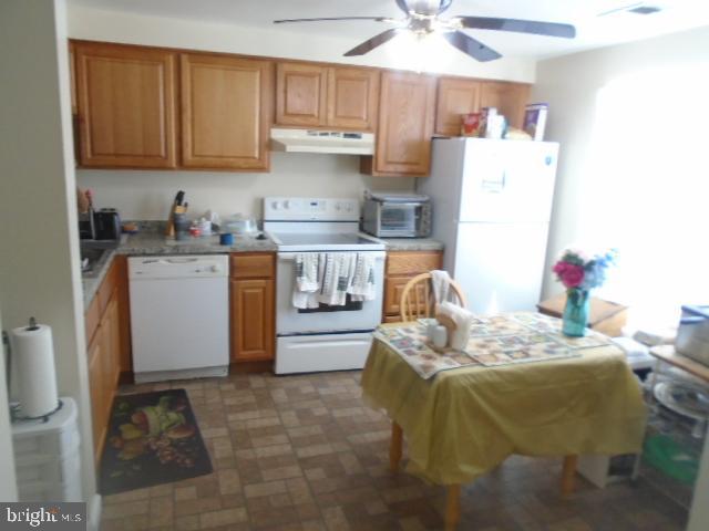 109 Kettering Drive Upper Marlboro, MD 20774 - Photo 6 of 15 a bed room with a bed and a refrigerator