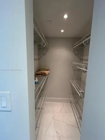 a view of an empty walk in closet