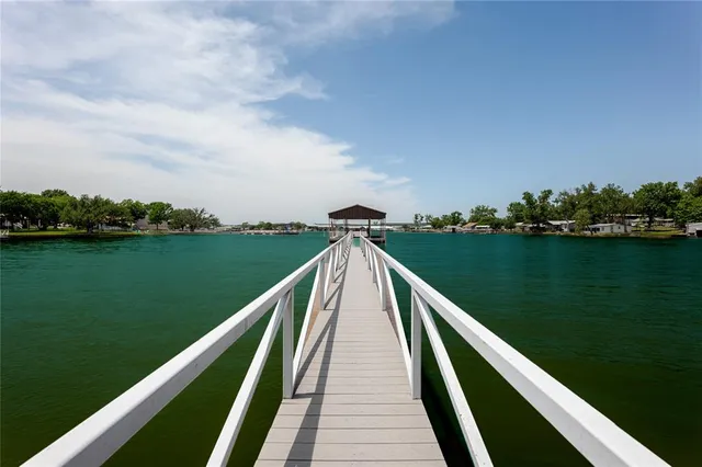 a view of a wooden deck with a yard