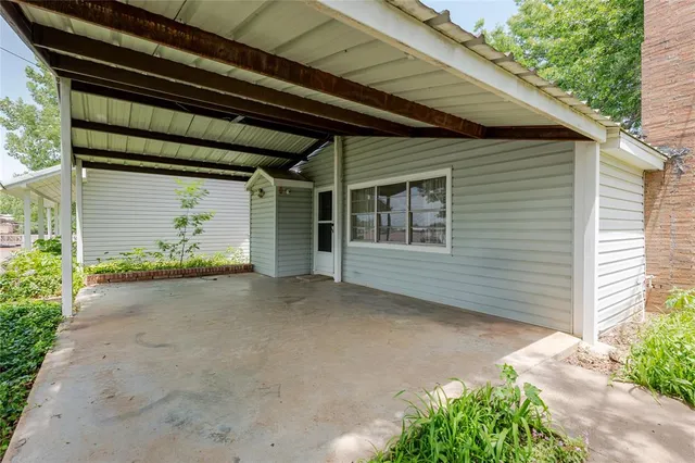 a living room with furniture and large windows