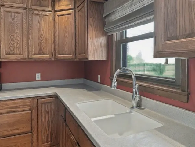 a kitchen with a sink and a window