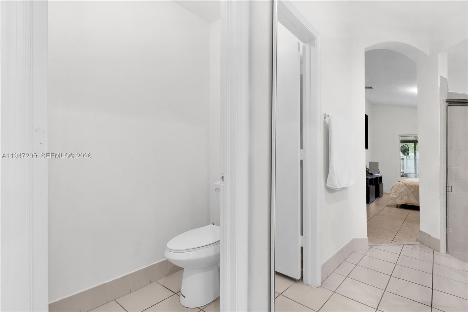 1959 Southeast 10th Street Homestead, FL 33035 - Photo 12 of 39 a bathroom with a granite countertop toilet and a shower