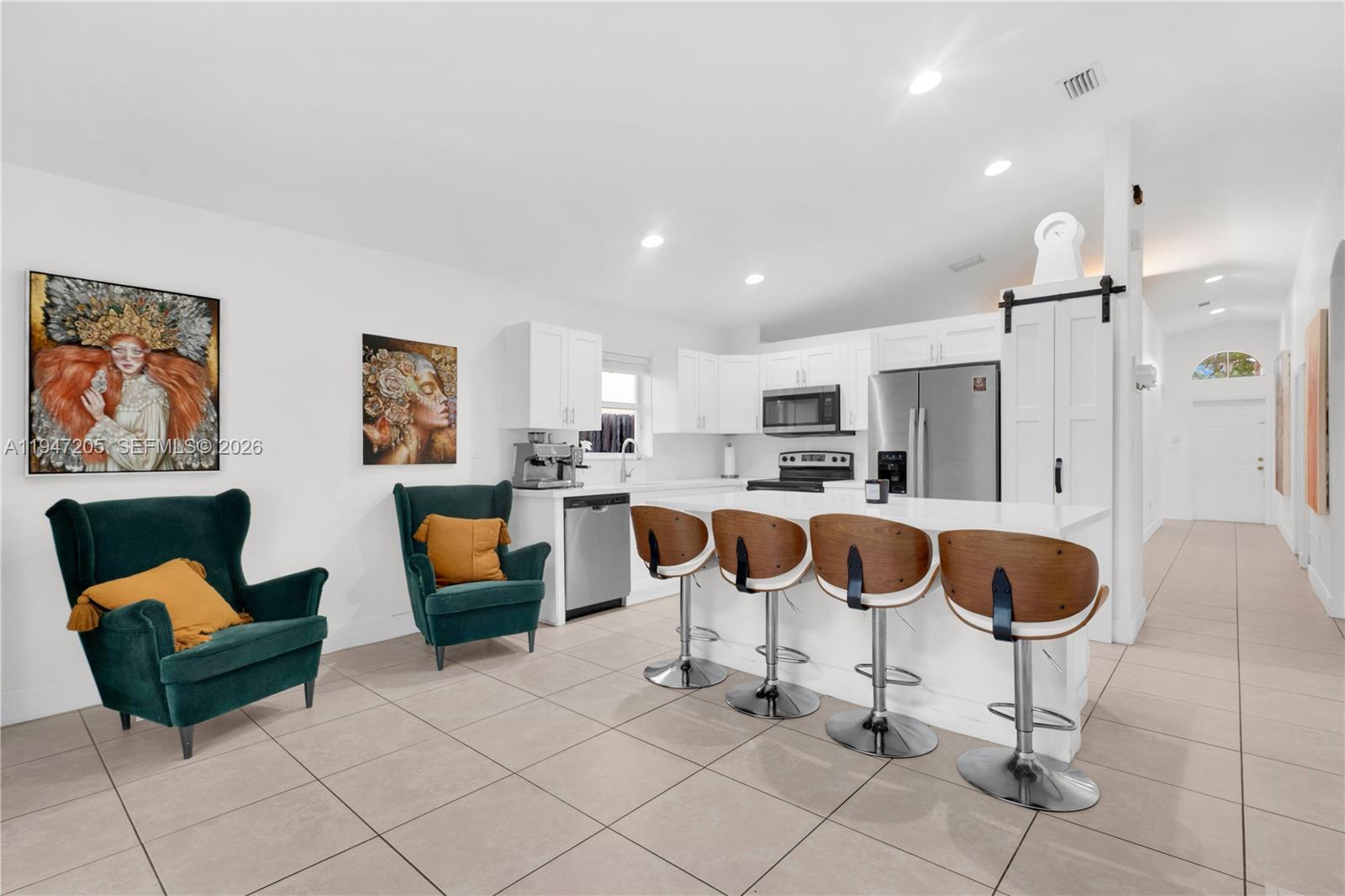 1959 Southeast 10th Street Homestead, FL 33035 - Photo 13 of 39 a living room with furniture and kitchen view