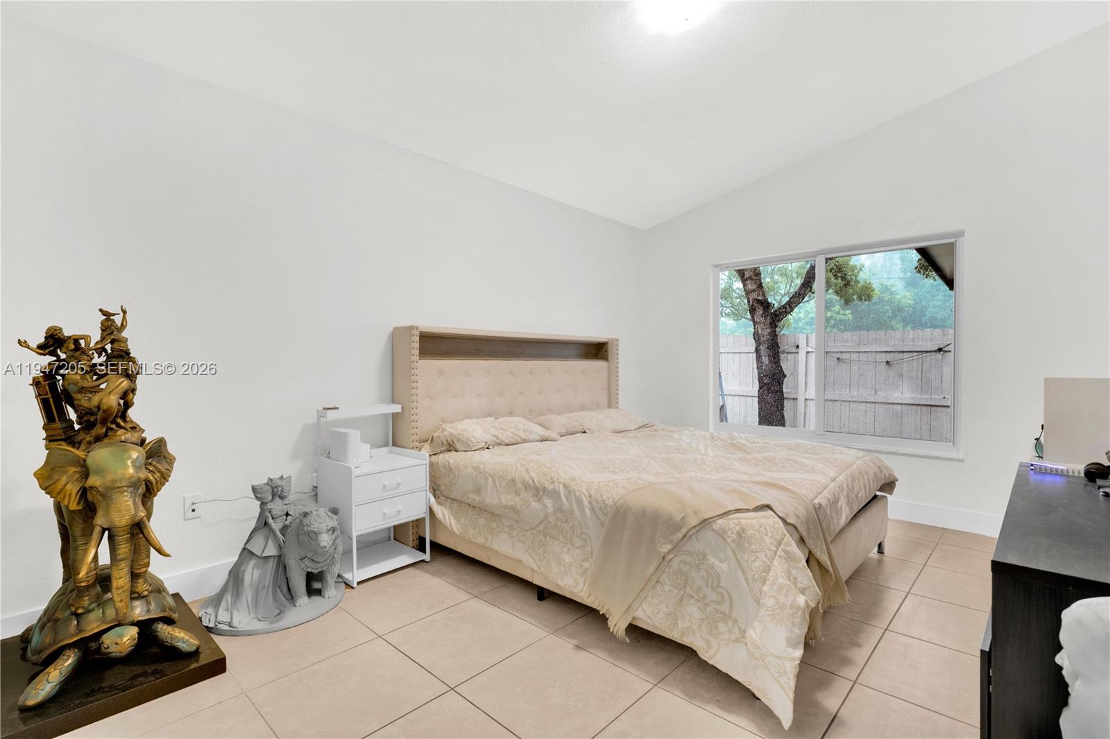 1959 Southeast 10th Street Homestead, FL 33035 - Photo 18 of 39 a bedroom with a bed and a window