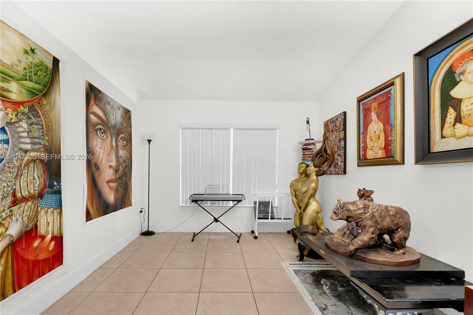 1959 Southeast 10th Street Homestead, FL 33035 - Photo 24 of 39 a living room with furniture and painting on the wall