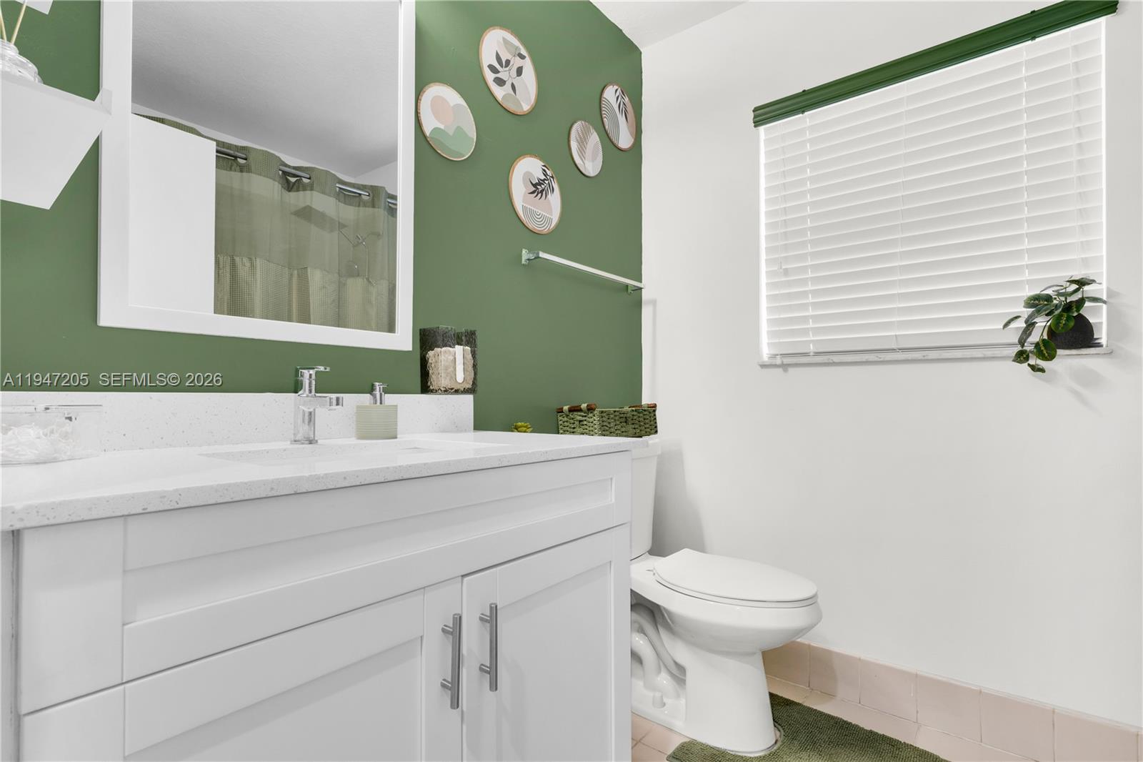 1959 Southeast 10th Street Homestead, FL 33035 - Photo 26 of 39 a bathroom with a toilet sink and mirror
