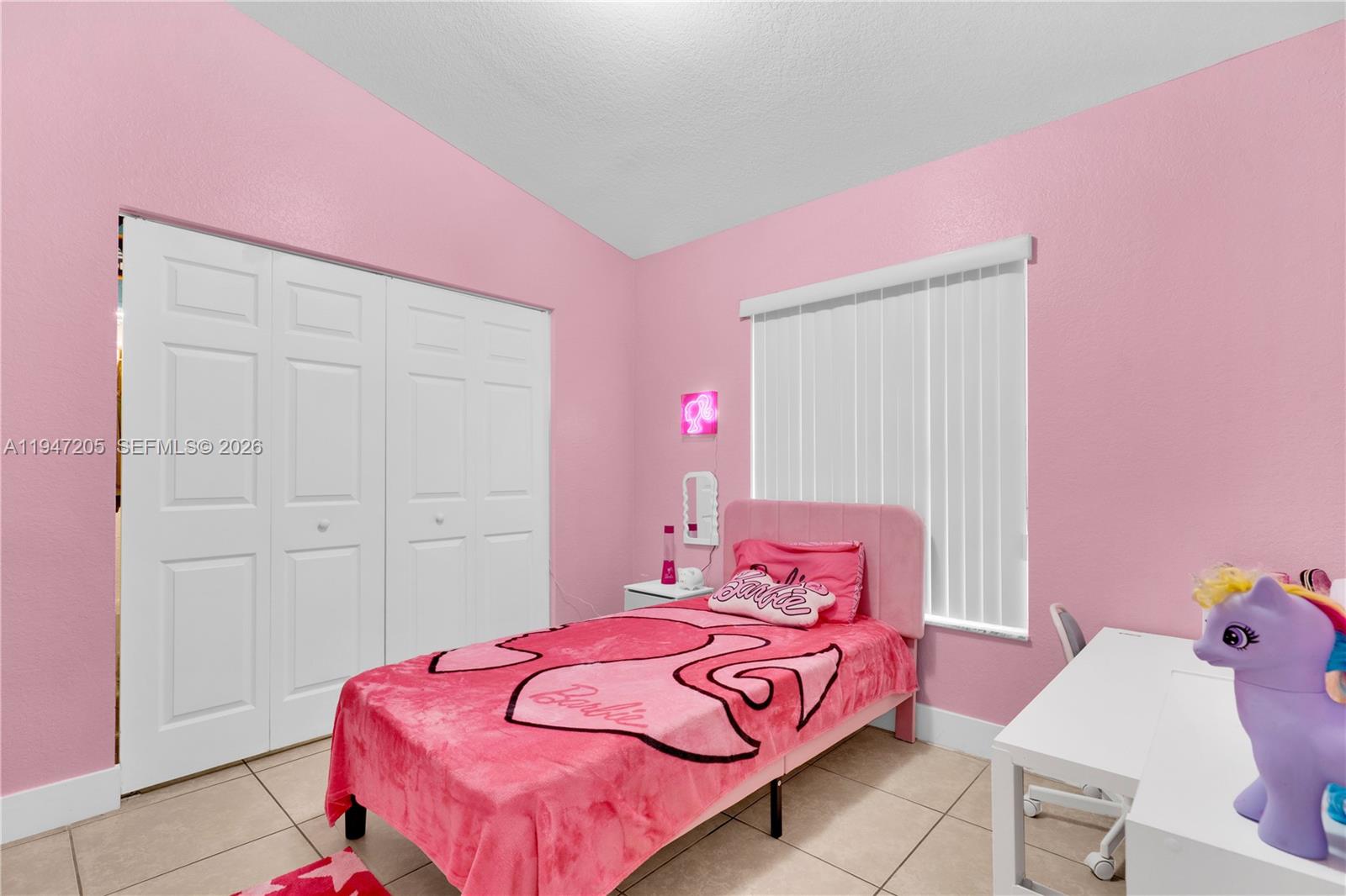 1959 Southeast 10th Street Homestead, FL 33035 - Photo 27 of 39 a bedroom with a bed and a potted plant