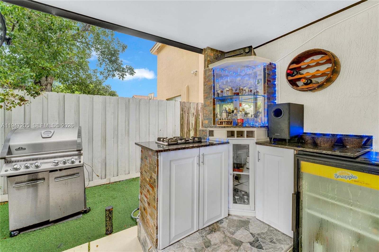 1959 Southeast 10th Street Homestead, FL 33035 - Photo 29 of 39 a kitchen with a stove a refrigerator and a table