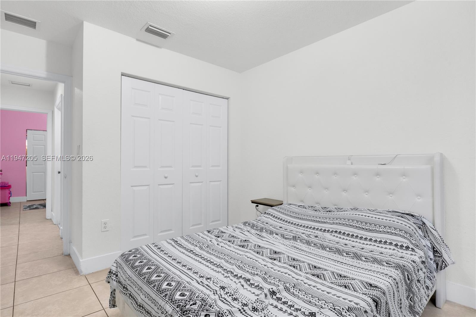 1959 Southeast 10th Street Homestead, FL 33035 - Photo 32 of 39 a bedroom with a bed and a shower