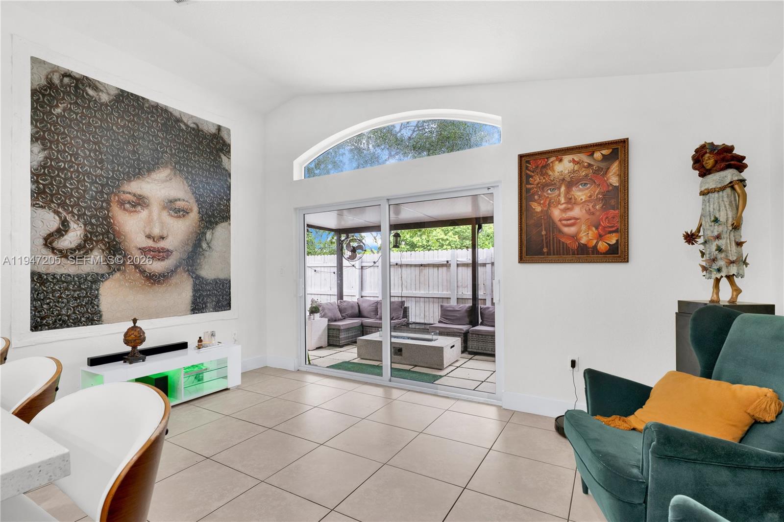 1959 Southeast 10th Street Homestead, FL 33035 - Photo 34 of 39 a living room with furniture and a large window