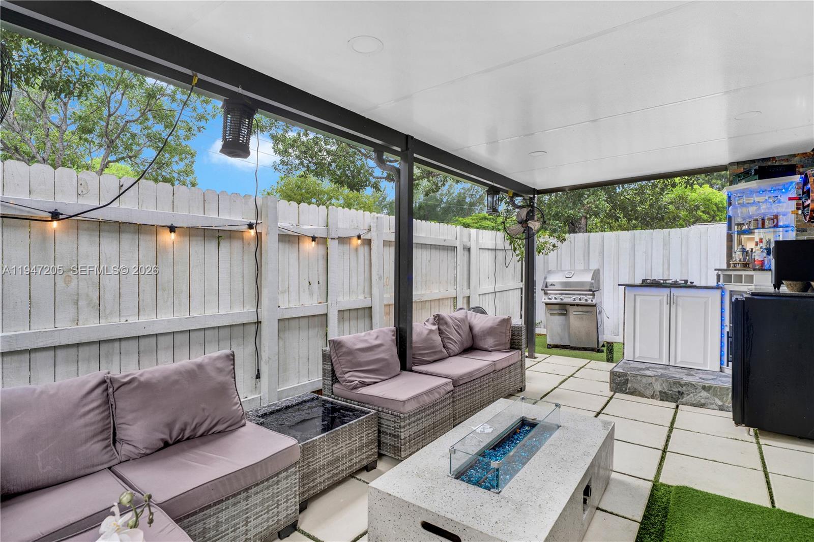 1959 Southeast 10th Street Homestead, FL 33035 - Photo 36 of 39 a outdoor living space with furniture and garden view