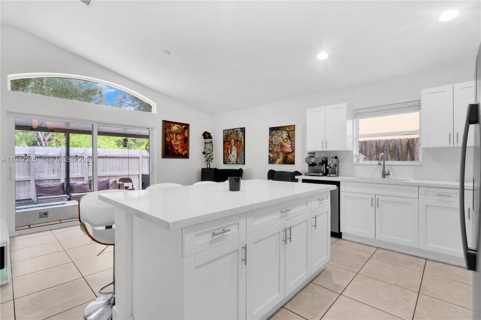 1959 Southeast 10th Street Homestead, FL 33035 - Photo 38 of 39 a large white kitchen with a large window