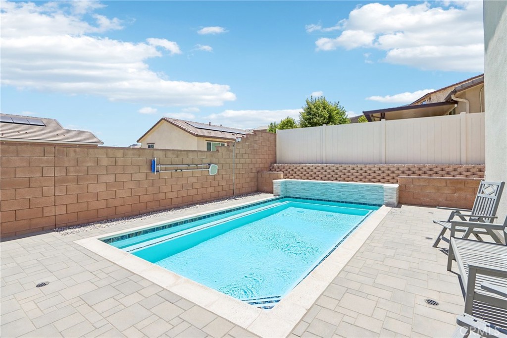 11056 Guffey Ranch Way Corona, CA 92883 - Photo 45 of 61 a view of swimming pool with a lounge chairs