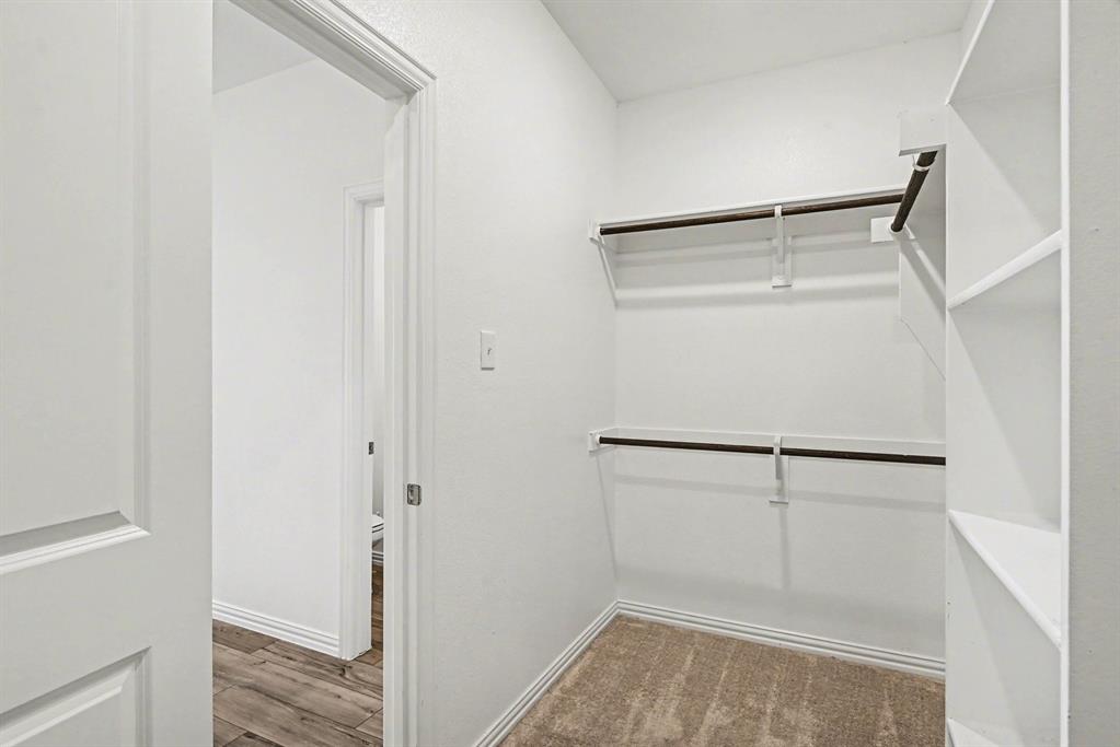 10004 Thornapple Road Fort Worth, TX 76179 - Photo 16 of 39 a view of an empty walk in closet