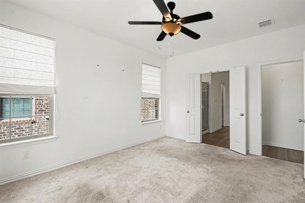 10004 Thornapple Road Fort Worth, TX 76179 - Photo 19 of 39 a view of a big room with wooden floor and windows
