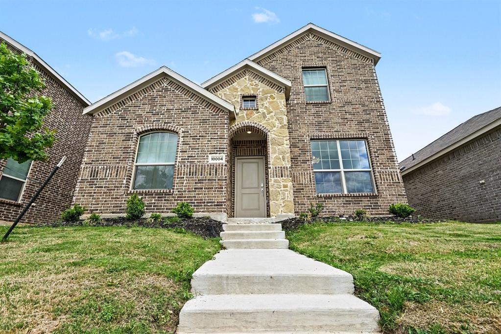 10004 Thornapple Road Fort Worth, TX 76179 - Photo 2 of 39 a front view of a house with garden