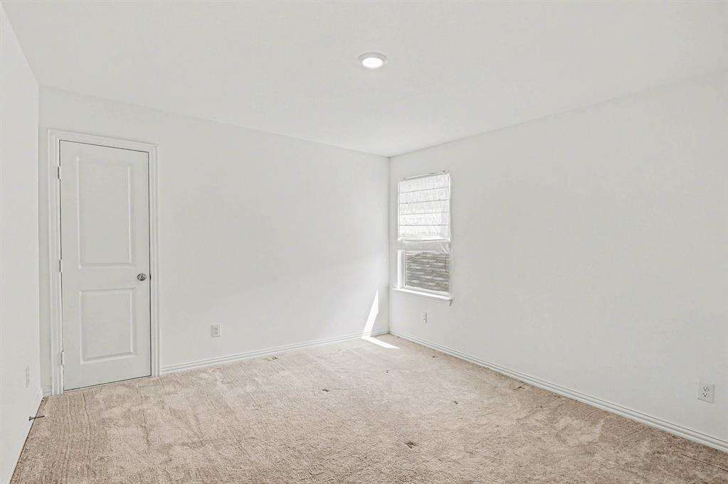 10004 Thornapple Road Fort Worth, TX 76179 - Photo 26 of 39 an empty room with windows