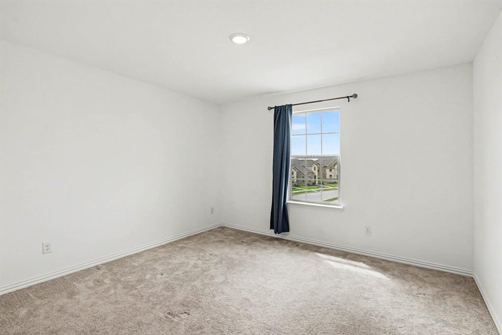 10004 Thornapple Road Fort Worth, TX 76179 - Photo 28 of 39 an empty room with a window