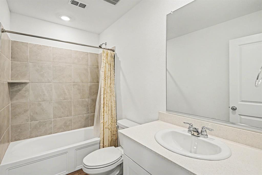 10004 Thornapple Road Fort Worth, TX 76179 - Photo 30 of 39 a bathroom with a sink toilet and shower