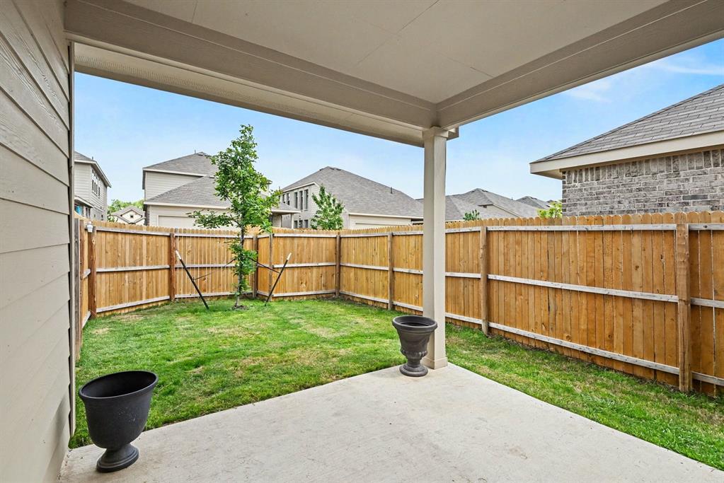 10004 Thornapple Road Fort Worth, TX 76179 - Photo 32 of 39 a view of a backyard with wooden fence