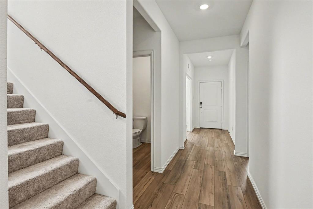 10004 Thornapple Road Fort Worth, TX 76179 - Photo 4 of 39 a view of entryway and hall with wooden floor