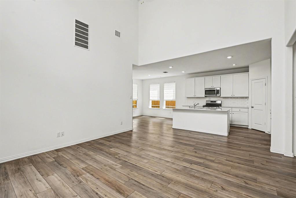10004 Thornapple Road Fort Worth, TX 76179 - Photo 9 of 39 a view of kitchen with wooden floor