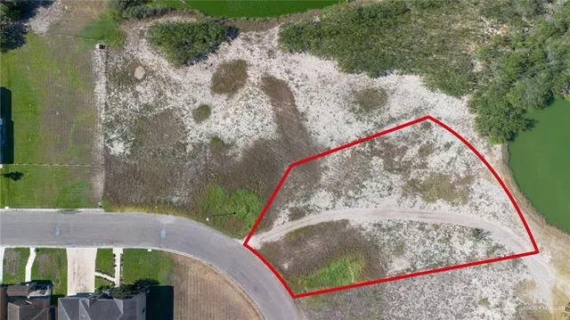 a view of a lake with a yard