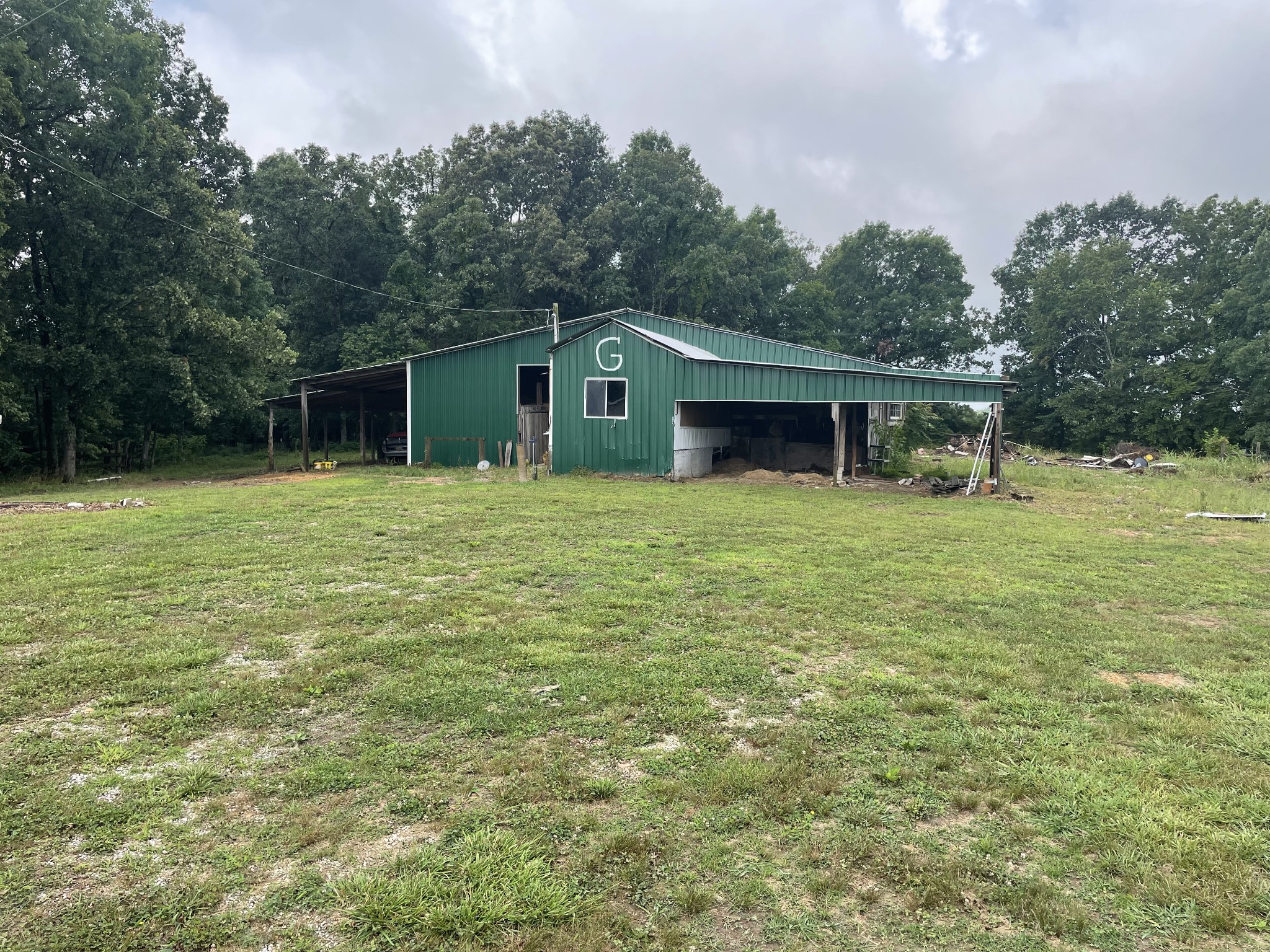 379 Dady Road McEwen, TN 37101 - Photo 14 of 34 a backyard of a house with yard and outdoor seating