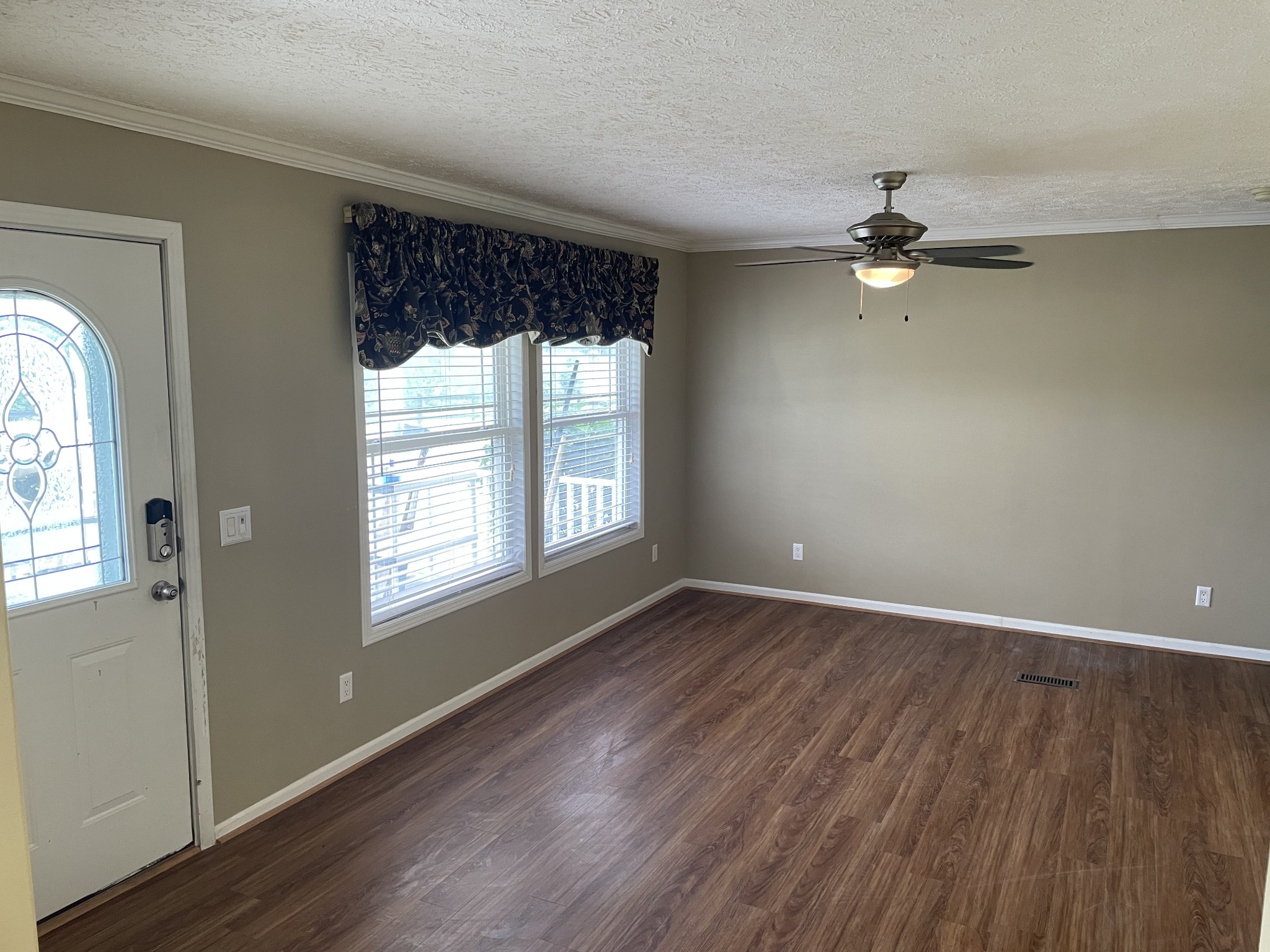 379 Dady Road McEwen, TN 37101 - Photo 22 of 34 an empty room with wooden floor fan and windows