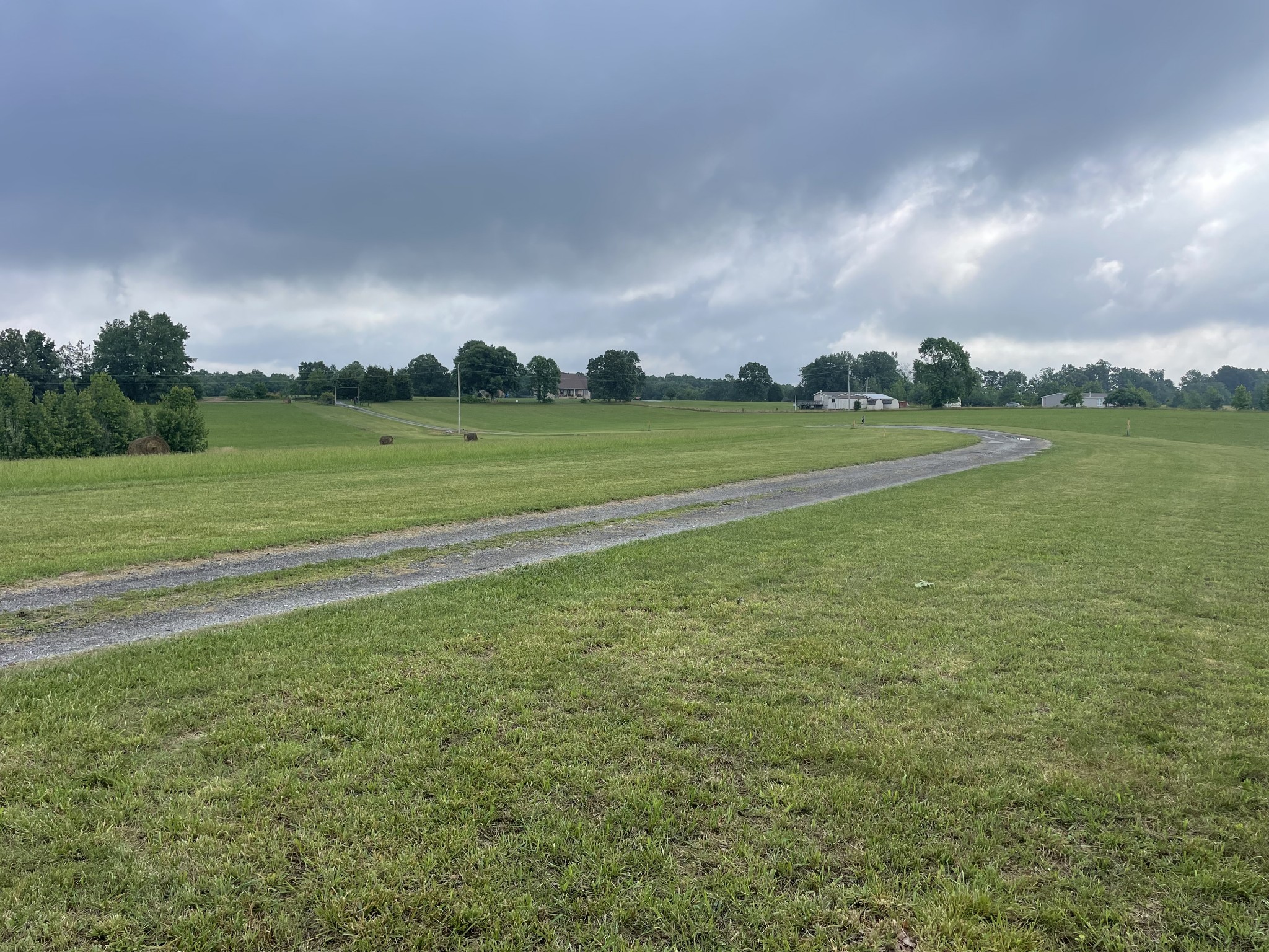 379 Dady Road McEwen, TN 37101 - Photo 8 of 34 a view of a field with an trees in the background