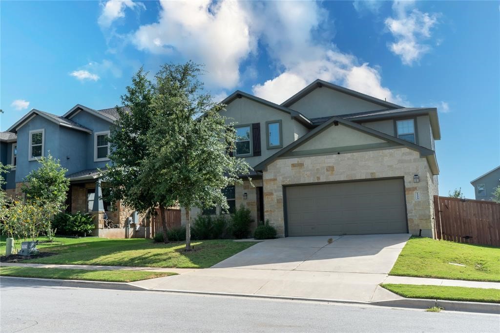 1333 Terrace View Drive Georgetown, TX 78628 - Photo 4 of 35 A stone-accented facade complements the well-manicured lawn and attached garage.