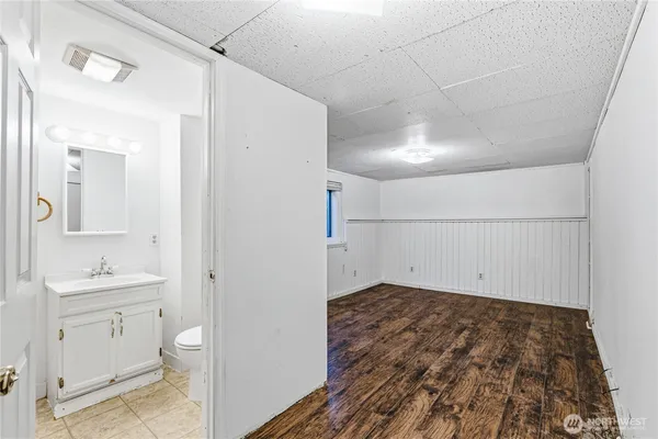 a view of a room with wooden floor