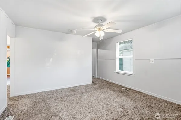 a view of an empty room with a window