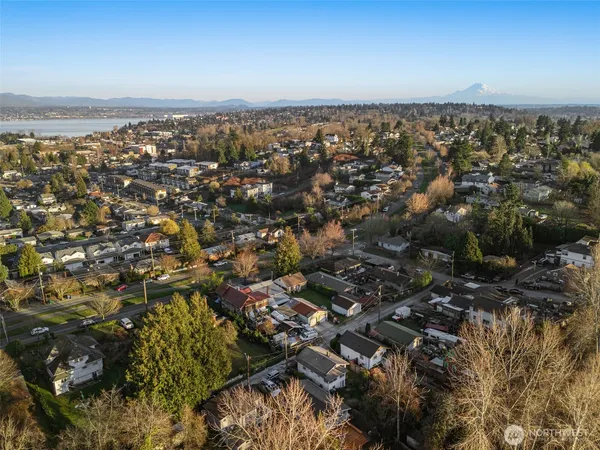 an aerial view of a houses with yard