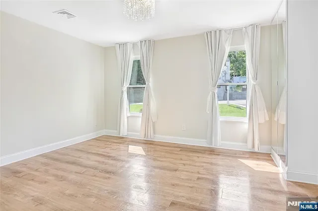 a bathroom with a shower sink and mirror