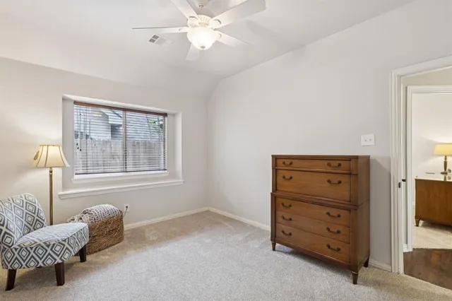 a bedroom with bed and a chandelier