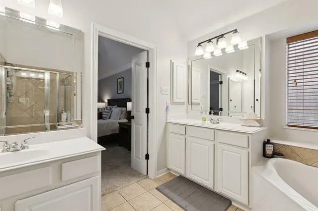 a bedroom with furniture and a flat screen tv