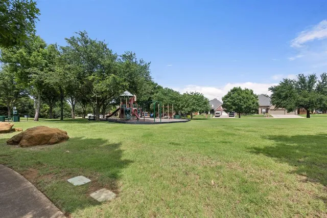a view of lake with green space