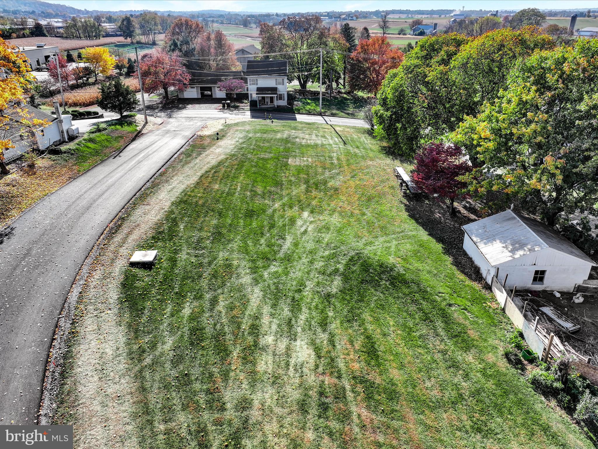 an aerial view of a house with yard swimming pool and outdoor seating