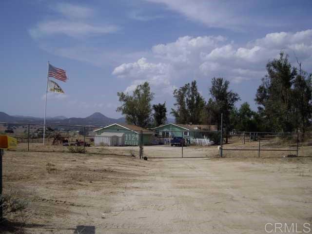a view of three house with outdoor space