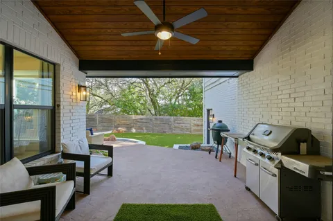 a view of a patio with a backyard