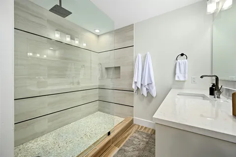 a bathroom with a sink and mirror