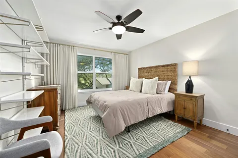 a bedroom with bed and window