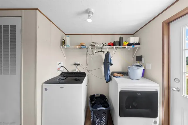 a view of a city with lawn chairs and large trees