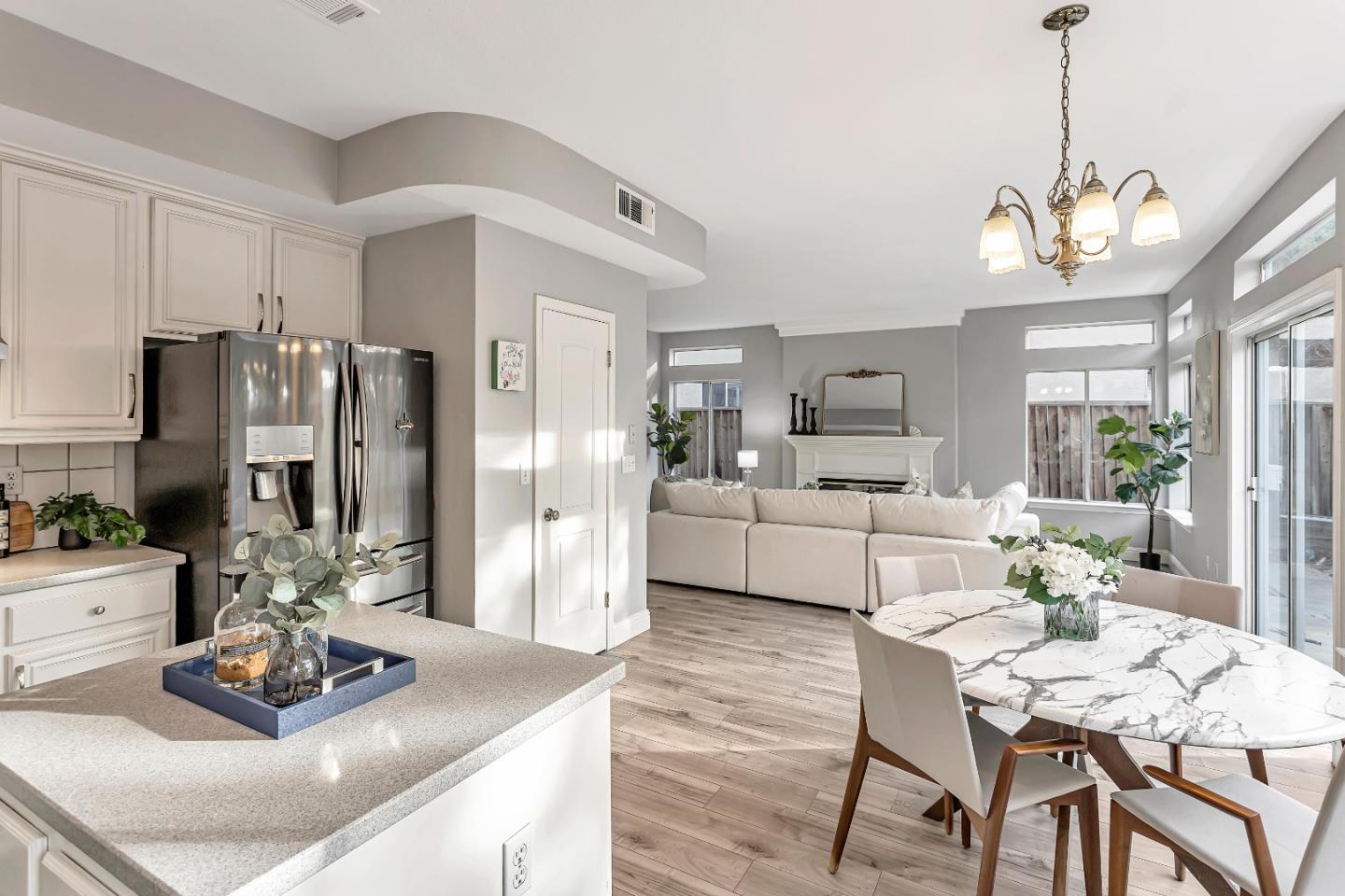 1173 Eagle Ridge Way Milpitas, CA 95035 - Photo 11 of 30 a view of a dining room kitchen and a chandelier