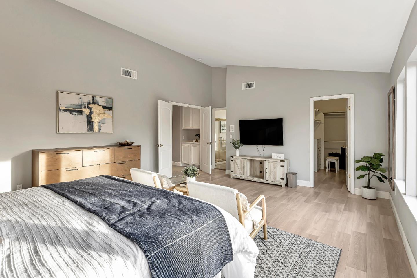 1173 Eagle Ridge Way Milpitas, CA 95035 - Photo 18 of 30 a bedroom with a bed a flat screen tv and a couch