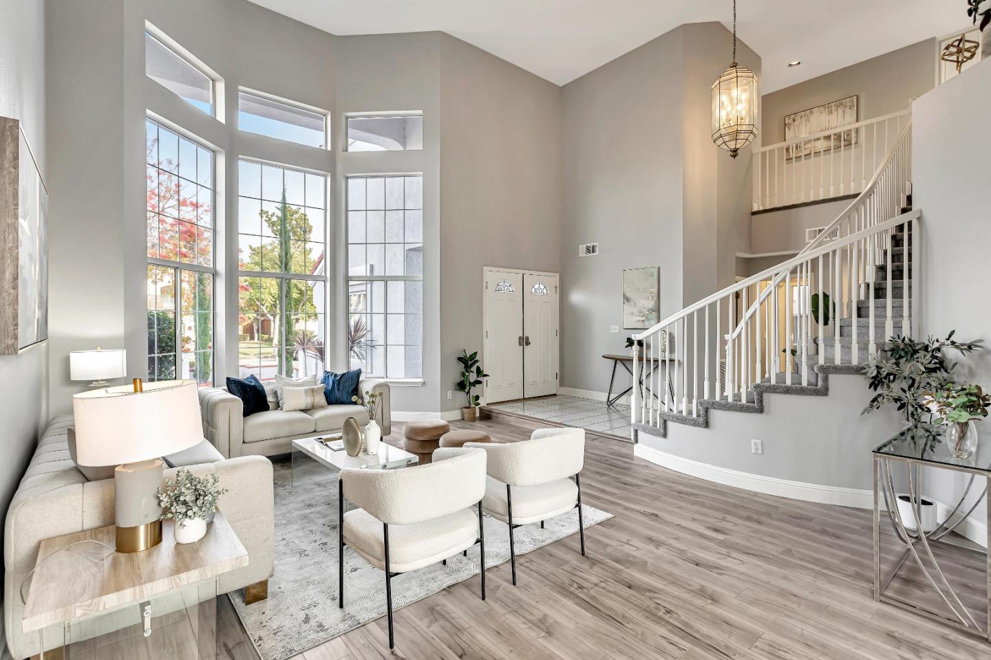 1173 Eagle Ridge Way Milpitas, CA 95035 - Photo 2 of 30 a living room with furniture and floor to ceiling windows