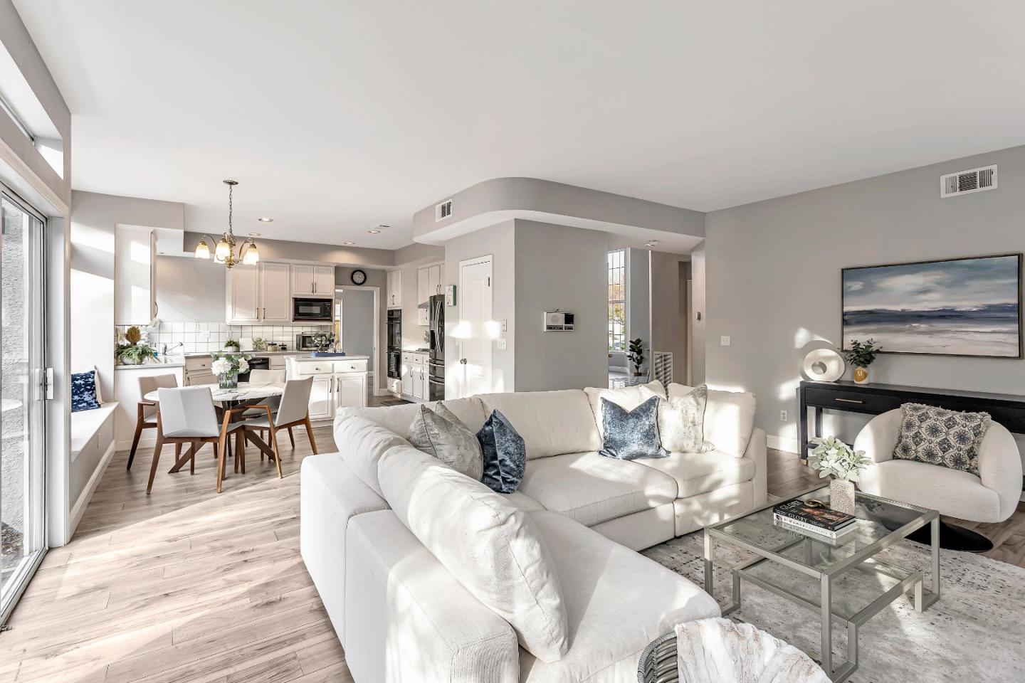 1173 Eagle Ridge Way Milpitas, CA 95035 - Photo 5 of 30 a living room with furniture and a dining table with wooden floor