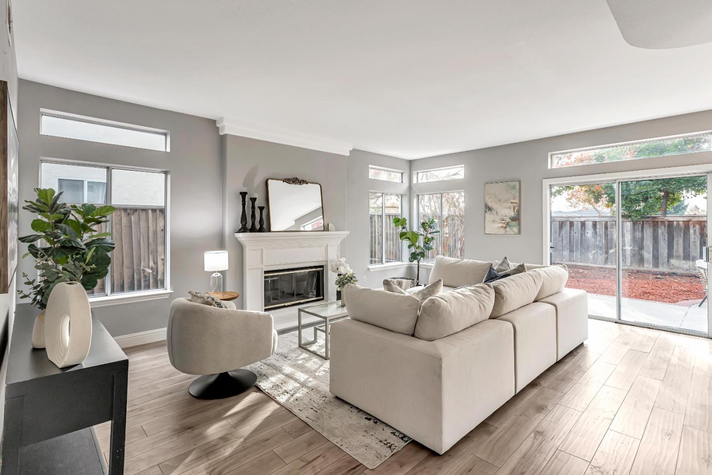 1173 Eagle Ridge Way Milpitas, CA 95035 - Photo 6 of 30 a living room with furniture a fireplace and a potted plant